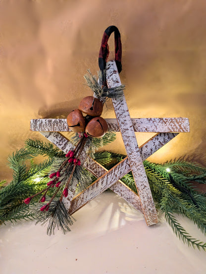 Decorative star with greenery and bells on a gold background